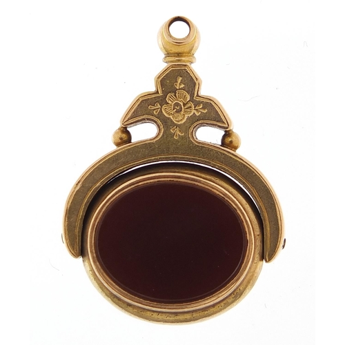 919 - Victorian unmarked gold bloodstone and carnelian spinner fob, 3cm high, 4.8g