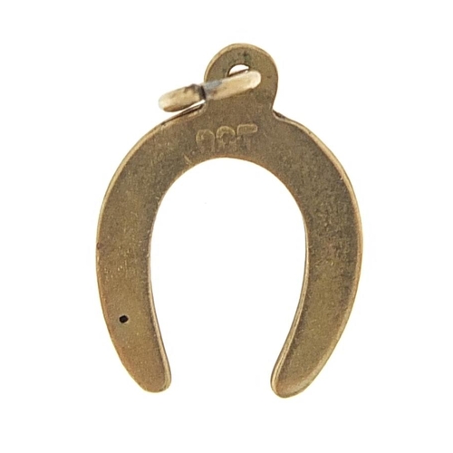 1004 - 9ct gold horseshoe charm, 1.5cm high, 0.4g