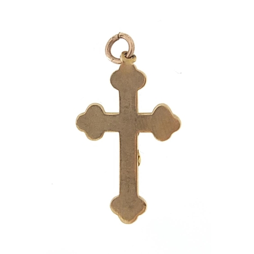 1010 - 9ct gold crucifix pendant, 2.2cm high, 0.7g