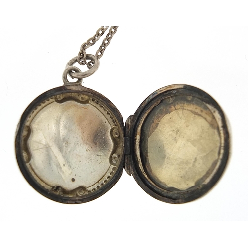 1026 - Circular silver locket on a silver necklace, the locket hallmarked Birmingham 1916, 2.2cm in diamete... 