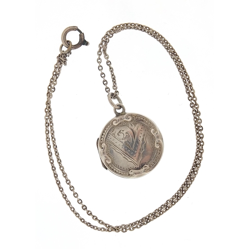 1026 - Circular silver locket on a silver necklace, the locket hallmarked Birmingham 1916, 2.2cm in diamete... 