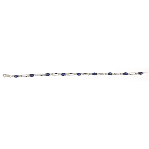 1064 - Silver, blue sapphire and cubic zirconia bracelet, 20cm in length, 9.8g