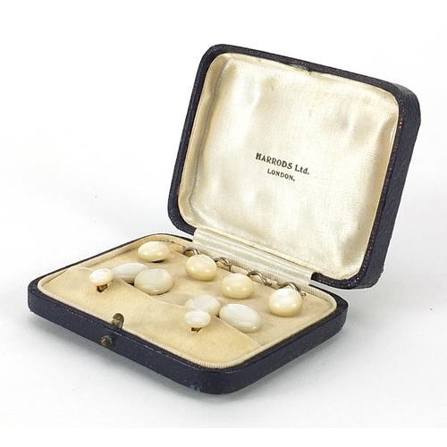 1092 - Set of gentlemen's mother of pearl cufflinks and dress studs, housed in a Harrods London fitted box