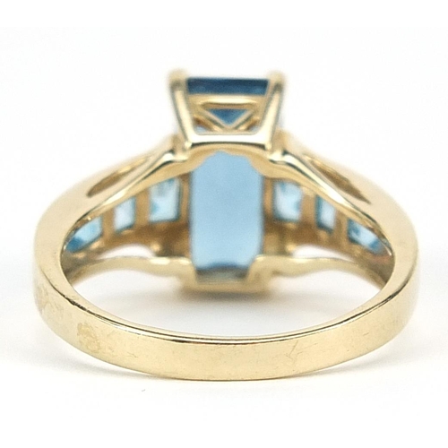 930 - 9ct gold blue topaz ring, size P, 4.4g