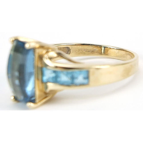 930 - 9ct gold blue topaz ring, size P, 4.4g