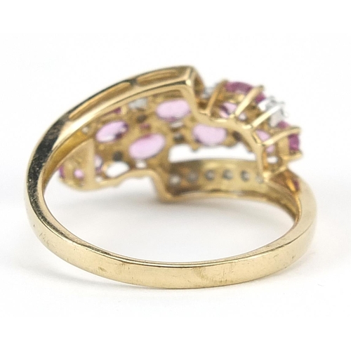 940 - 9ct gold pink topaz and diamond crossover ring, size Q, 2.9g