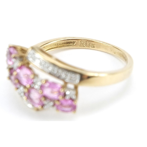 940 - 9ct gold pink topaz and diamond crossover ring, size Q, 2.9g