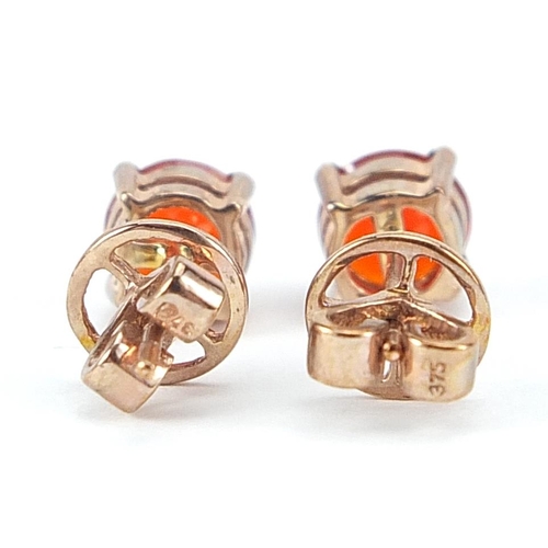 984 - Pair of 9ct rose gold fire opal solitaire stud earrings, 6mm in diameter, 2.0g