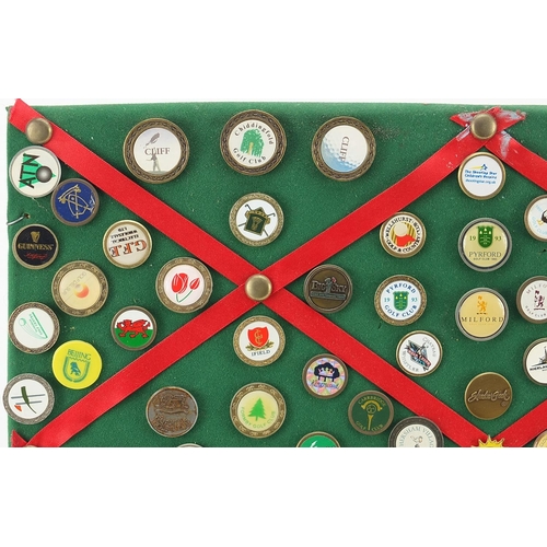 1286 - Collection of vintage and later golf badges mounted on a board