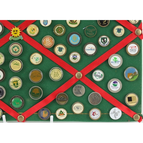 1286 - Collection of vintage and later golf badges mounted on a board