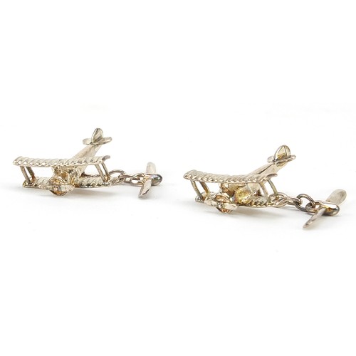 1114 - Pair of novelty silver bi-plane cufflinks, housed in a Fish Bros Ltd fitted box, J A M maker's mark,... 