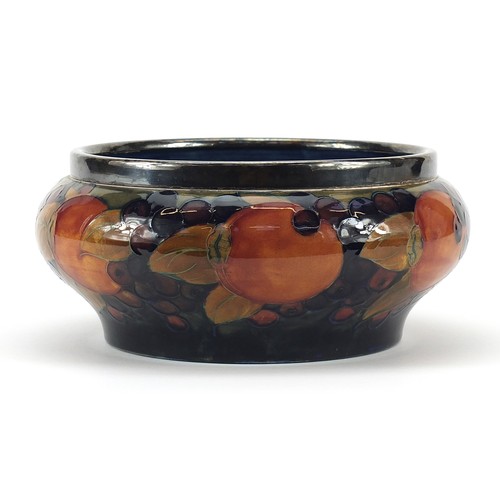 325A - William Moorcroft pottery bowl with silver plated rim hand painted with flowers, 21cm in diameter