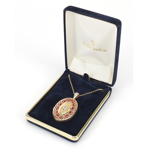 796 - The Victoria Collection Carlyle 14ct gold enamel and diamond locket on a 14ct gold necklace, with ce... 