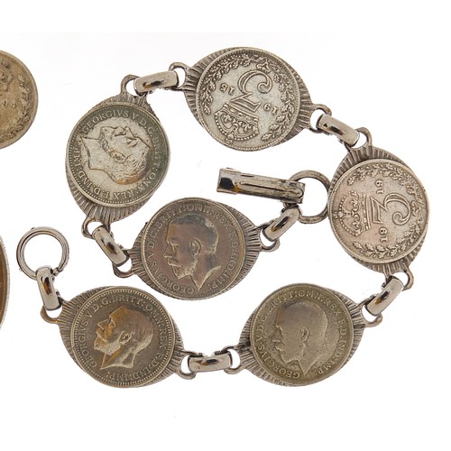 1149 - Jewellery and coins comprising a silver rope twist necklace, 60cm in length, 16.8g, three silver thr... 