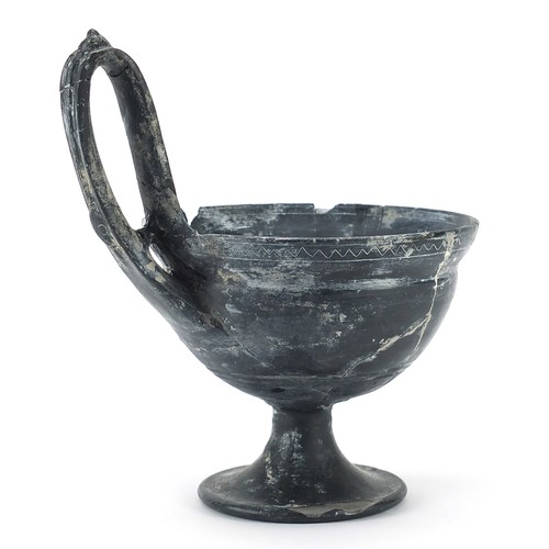 285 - Antique Roman Blackware handled vessel, 18.5cm high