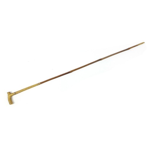 438 - Edwardian bamboo walking sword stick with ornate gilt metal mounts and steel blade, 89cm in length