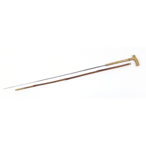 438 - Edwardian bamboo walking sword stick with ornate gilt metal mounts and steel blade, 89cm in length