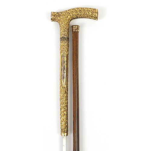 438 - Edwardian bamboo walking sword stick with ornate gilt metal mounts and steel blade, 89cm in length