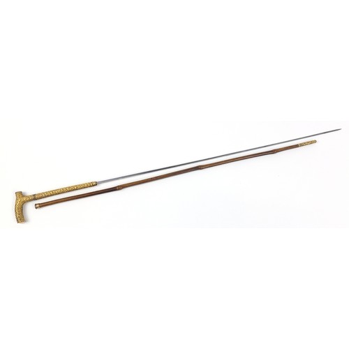 438 - Edwardian bamboo walking sword stick with ornate gilt metal mounts and steel blade, 89cm in length