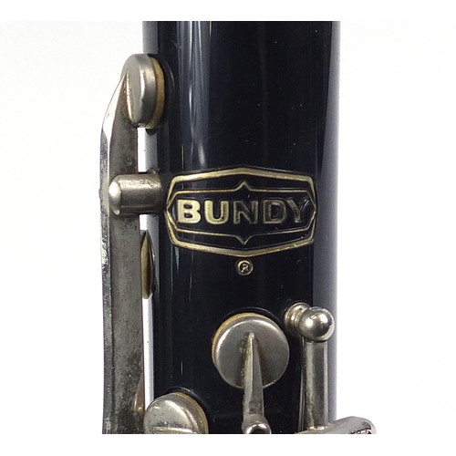 703 - Bundy four piece clarinet by The Selmer Company USA, housed in a fitted case