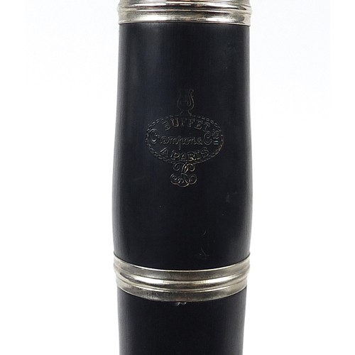 704 - Buffet four piece ebonised clarinet retailed by Crampon & Co, Paris, housed in a fitted box