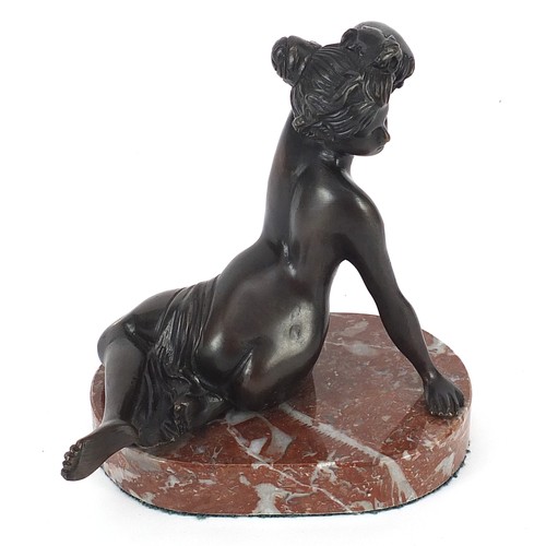 186 - Patinated bronze semi nude figurine raised on a marble base, 14cm high