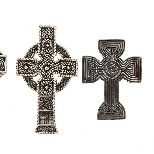 1110A - Four silver Celtic cross pendants, the largest 4.9cm high, total 38.1g