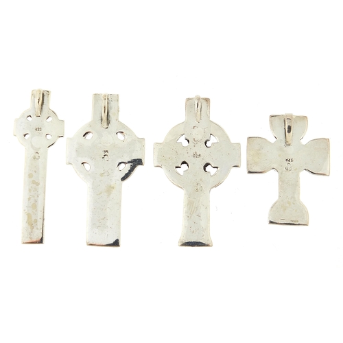 1110A - Four silver Celtic cross pendants, the largest 4.9cm high, total 38.1g