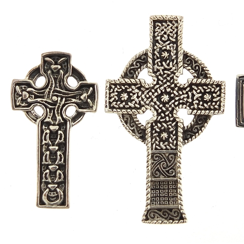 1122A - Four silver Celtic cross pendants, the largest 4.7cm high, total 30.4g