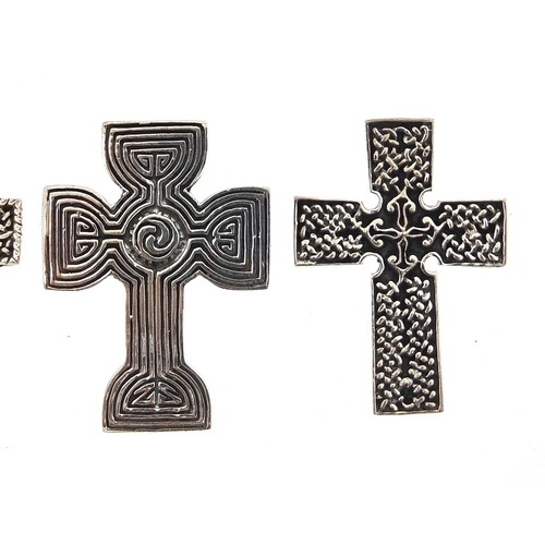 1122A - Four silver Celtic cross pendants, the largest 4.7cm high, total 30.4g