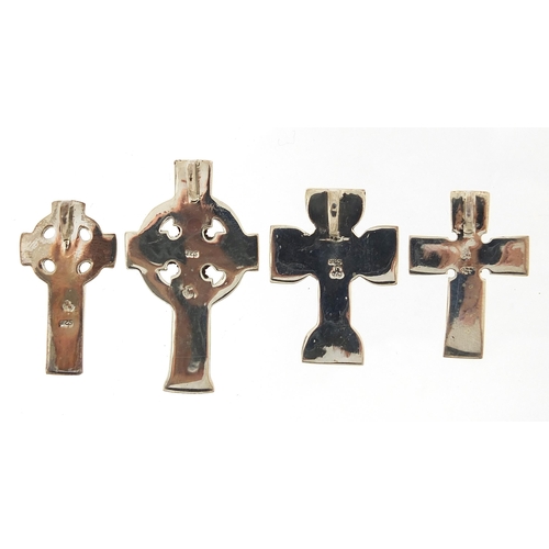 1122A - Four silver Celtic cross pendants, the largest 4.7cm high, total 30.4g