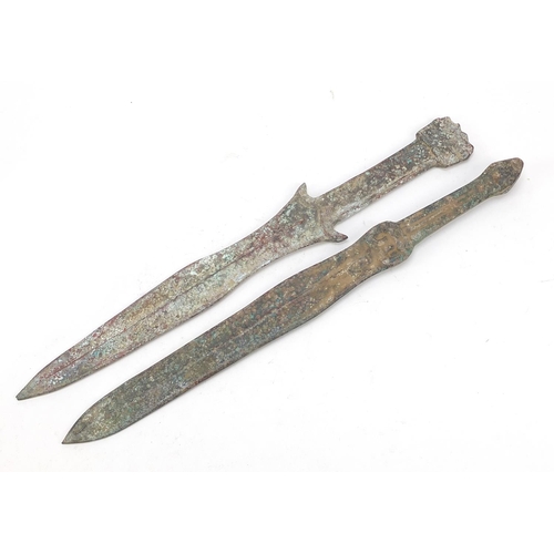 361 - Two Chinese/Islamic patinated bronze short swords, the largest 39cm in length,