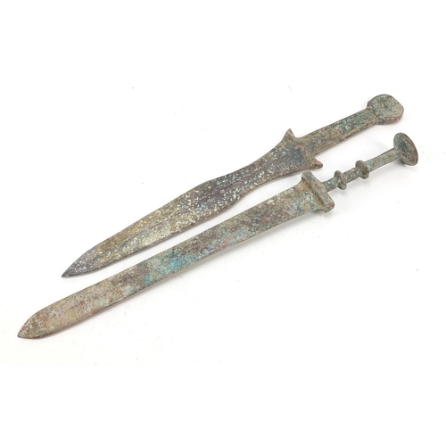 359 - Two Chinese/Islamic patinated bronze short swords, the largest 39cm in length