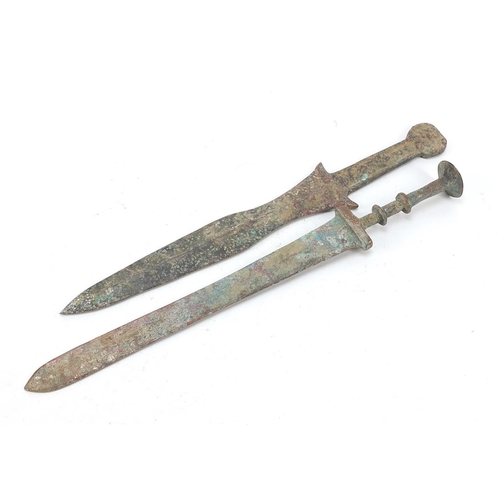 359 - Two Chinese/Islamic patinated bronze short swords, the largest 39cm in length