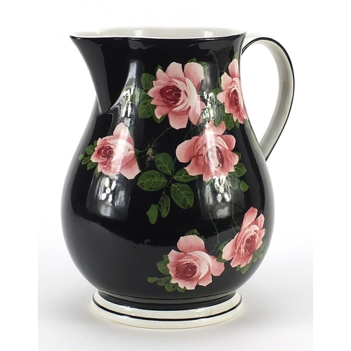 369 - Large Bristol porcelain jug decorated with roses, 27cm high