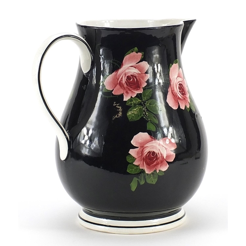 369 - Large Bristol porcelain jug decorated with roses, 27cm high