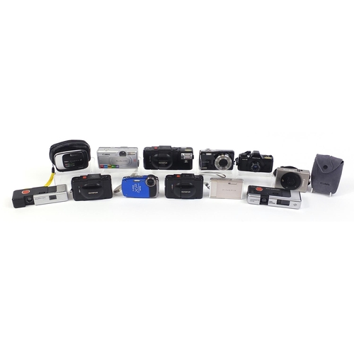 1546 - Group of digital cameras including Olympus, Canon and Fujifilm