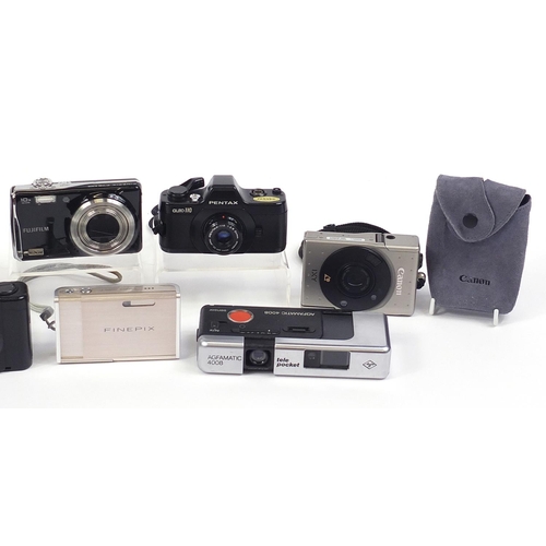 1546 - Group of digital cameras including Olympus, Canon and Fujifilm