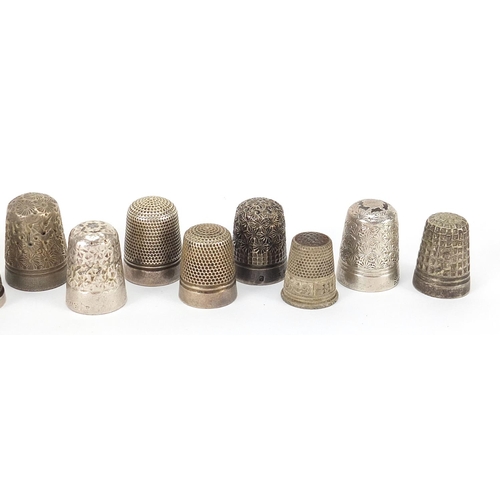 282 - Fifteen silver and white metal thimbles, the largest 2.5cm high, 86.4g