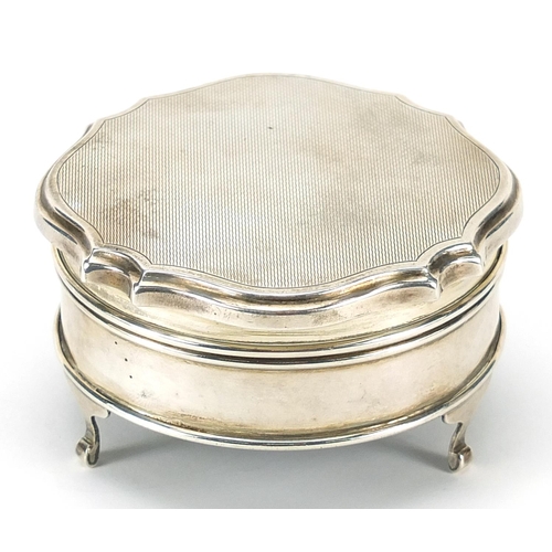 284 - Elizabeth II circular silver jewel box with hinged lid raised on three feet, indistinct maker's mark... 