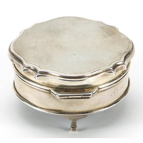 284 - Elizabeth II circular silver jewel box with hinged lid raised on three feet, indistinct maker's mark... 