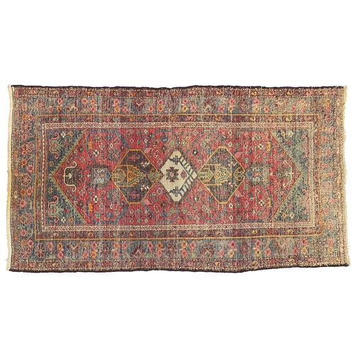 666A - Red and blue ground rug with geometric design, 205cm x 110cm