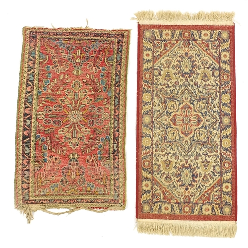 670A - Two small red ground rugs, the largest 100cm x 50cm