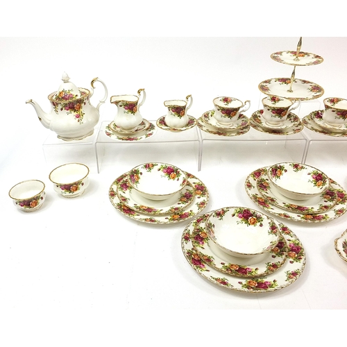 413 - Royal Albert Old Country Roses teaware and dinnerware including teapot, trios, cake stand and dinner... 