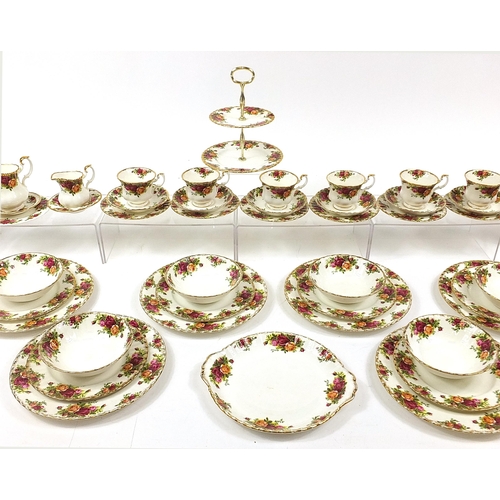 413 - Royal Albert Old Country Roses teaware and dinnerware including teapot, trios, cake stand and dinner... 