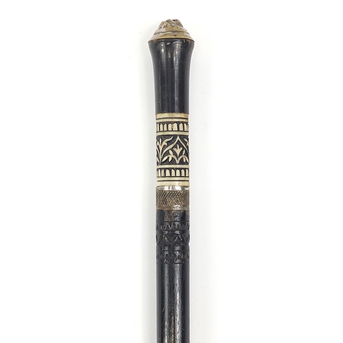 313 - Indian ebonised sword stick with carved bone section and horn handle, 92cm in length