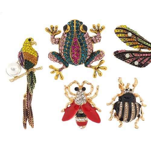 1145A - Seven jewelled and enamel animal and insect brooches including a bird with simulated pearland articu... 