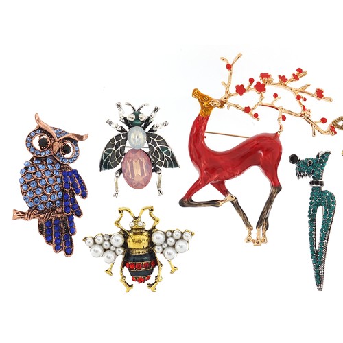 1112A - Seven jewelled and enamel animal and insect brooches including stag, owl, dragonfly and dog, the lar... 