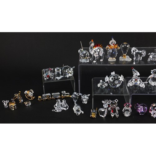 507 - Collection of crystal figures and animals, mostly Swarovski examples, the largest 8cm high