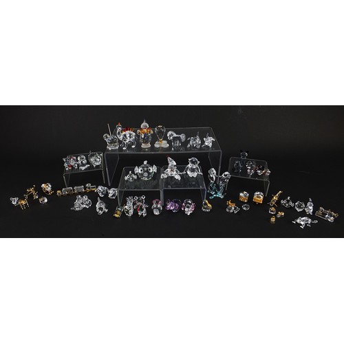 507 - Collection of crystal figures and animals, mostly Swarovski examples, the largest 8cm high